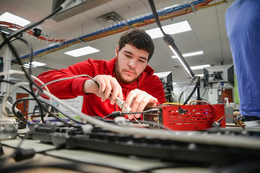 Photo of student building a gaming console at GO TEC partner Southern Virginia Higher Education Center’s Career Tech Academy (CTA-IT).